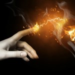 a woman pointing to the illuminated bulb