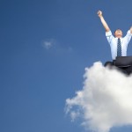 happy man on a cloud with PC