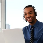 Customer Service agent in an office with laptop