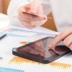 Businessman using a credit card and digital tablet for buying on-line