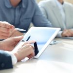 Business adviser analyzing financial figures denoting the progress
