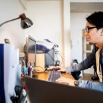 Men concentrating on work at home
