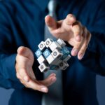 businessman-controls-management-3d-cubes