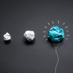 ideas-with-paper-crumpled-ball-with-lightbulb
