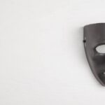 black-mask-white-wall