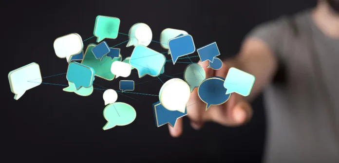 person touching speech bubbles