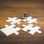 Tiny figure and jigsaw