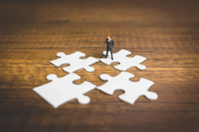 Tiny figure and jigsaw